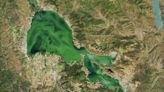 Troubled California lake turns so green it's visible from space