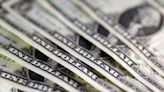 Dollar edges down ahead of data, set for first monthly drop in 2024