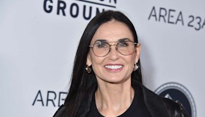 Demi Moore Stuns in Strapless White Dress With Gold Chain Halter