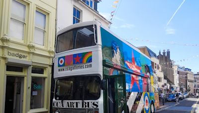 Brightly coloured bus designed by pop artist turns heads in city