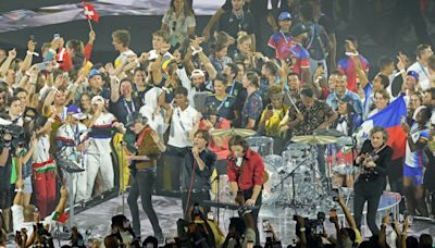 Olympic Games chaos as hundreds of athletes climb onto stage during closing ceremony