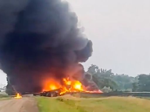 Several train cars carrying hazardous material are on fire after derailing in North Dakota