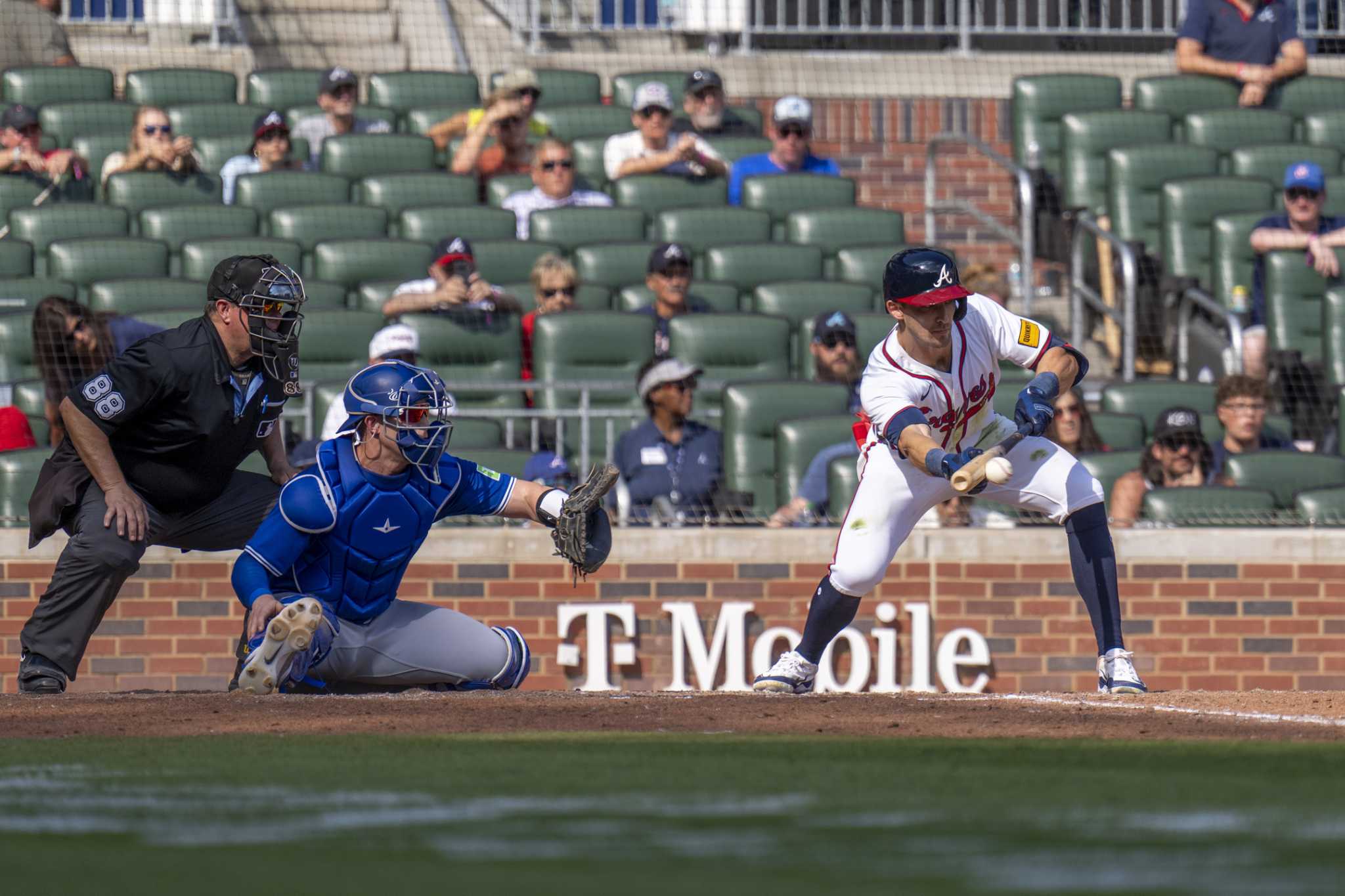 Braves rally to beat Blue Jays 4-3 in the 11th, move into a tie with Mets for final NL wild card