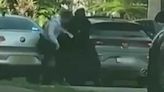 Moment alleged gunman struggles with cop outside John Ibrahim's home