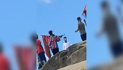 Shocking video shows men with flags and 'gun' at popular spot as cops called