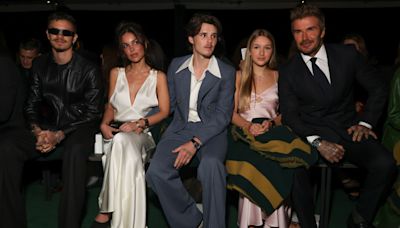 Victoria Beckham supported by family at Paris Fashion Week show