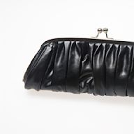 A small, handheld bag without straps. Often used for formal occasions or a night out. Comes in various shapes and materials, from simple leather designs to embellished styles with sequins or beading.