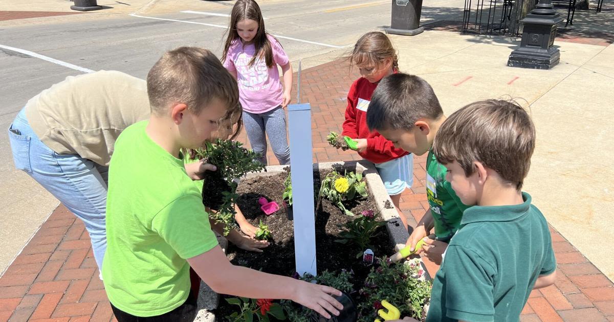 Downtown in bloom with pollinator-friendly flowers planted by St. Edward second graders