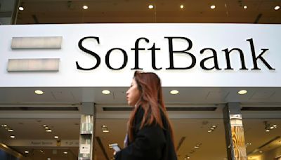 Japan's SoftBank Group trims investment losses but remains in red for fiscal year