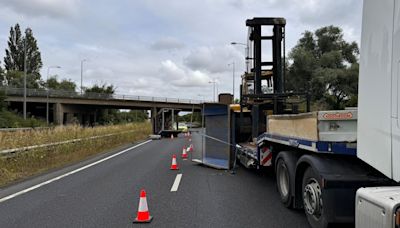 Major road partially closed after lorry hits bridge