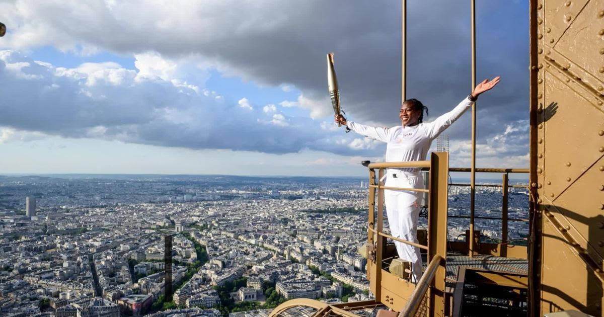 Olympic Torch Heads To The Top Of The Eiffel Tower