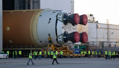 NASA rolls giant Artemis 2 moon rocket core off the factory floor for astronaut mission (video)