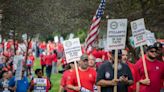 Striking auto workers target 38 new GM and Stellantis plants as strike enters second week