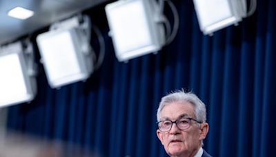 Fed holds interest rates steady, gives no sign it will cut soon as inflation fight stalls