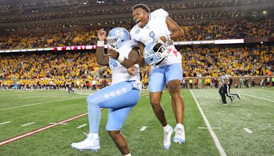 Charlotte head football coach Biff Poggi praises UNC program