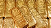 Gold advances over 2% on dollar slide, technical buying