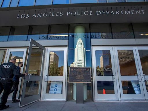 Investigation underway after video shows LAPD officer punch handcuffed man