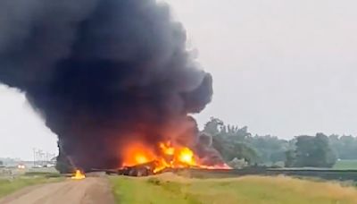 Several train cars carrying hazardous material are on fire after derailing in North Dakota