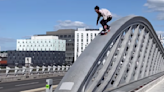 Skater's Risky Roll-In On Bridge Towards Incoming Traffic Too Good To Pass Up (Clip)