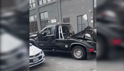 Driver Steals Truck Attempting To Tow His Pickup And Smashes Everything In His Path