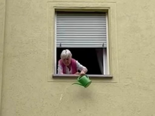 Fed up German pensioner pours water over drunk England fans