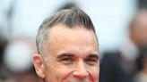 Famous birthdays for Feb. 13: Robbie Williams, Henry Rollins