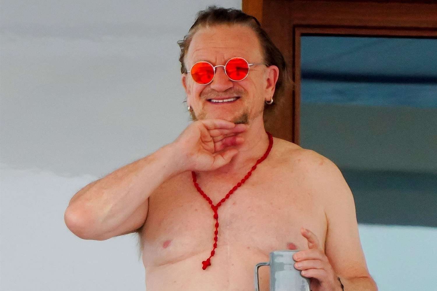 Bono Sports a Towel and a Rosary on Shirtless Yacht Outing in Saint-Tropez