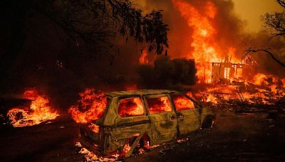 California Wildfire Sparks Thousands Of Evacuations (Photos)