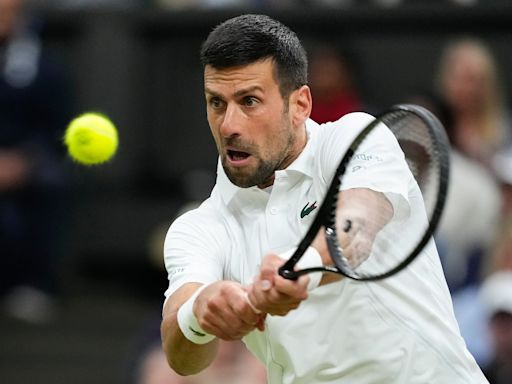 Novak Djokovic moves into Wimbledon semi-finals after Alex de Minaur withdraws with hip injury