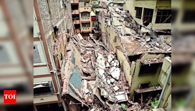 Two residential buildings collapse, cook injured | Surat News - Times of India