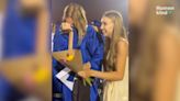 Watch girl fly to shock best friend during graduation ceremony