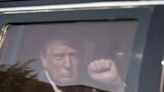 Former US president Donald Trump gestures as he arrives into the Captiol Hill Club back entrance on June 13, 2024 in Washington, DC