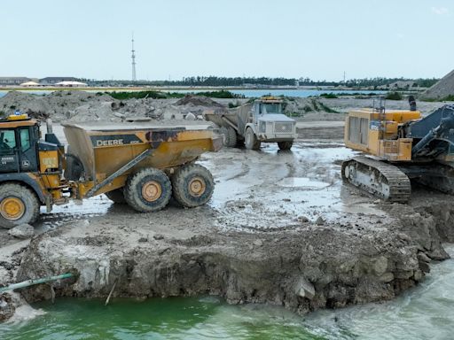 Watch: Robo-trucks clear land for Naples luxury community, operated from Fort Myers