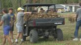 Mountain Home, Ark. football team helps tornado victims clean up debris