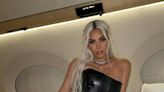 Kim Kardashian Wears A Leather Corset Gown On A Private Jet