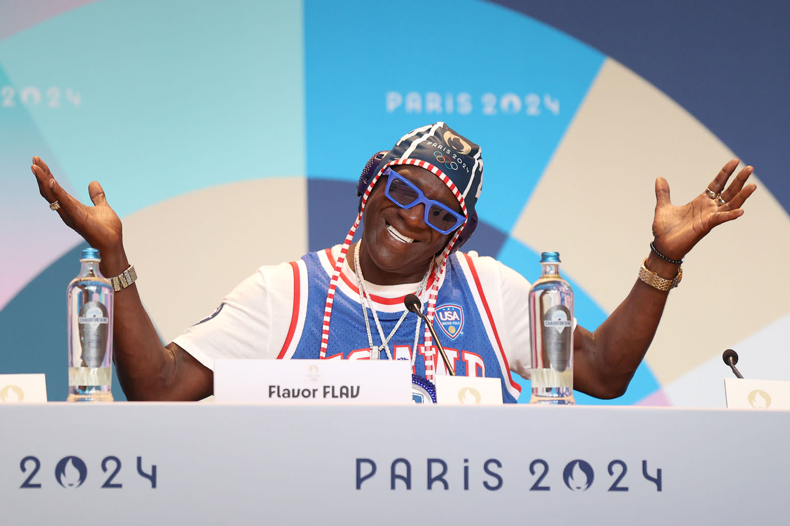 Watch Flavor Flav Meet & Hug Dr. Jill Biden While Cheering Women’s Water Polo at the 2024 Olympics