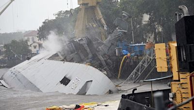 INS Brahmaputra catches fire: one sailor missing, ship resting on its side at Mumbai dockyard