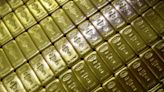 Gold holds near five-month low, focus turns to Jackson Hole