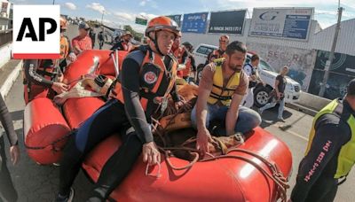 Horse rescued after being stranded on a rooftop by Brazil floods