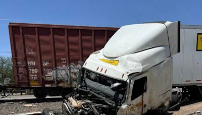 Driver severely injured after train and semi-truck collide in Dexter