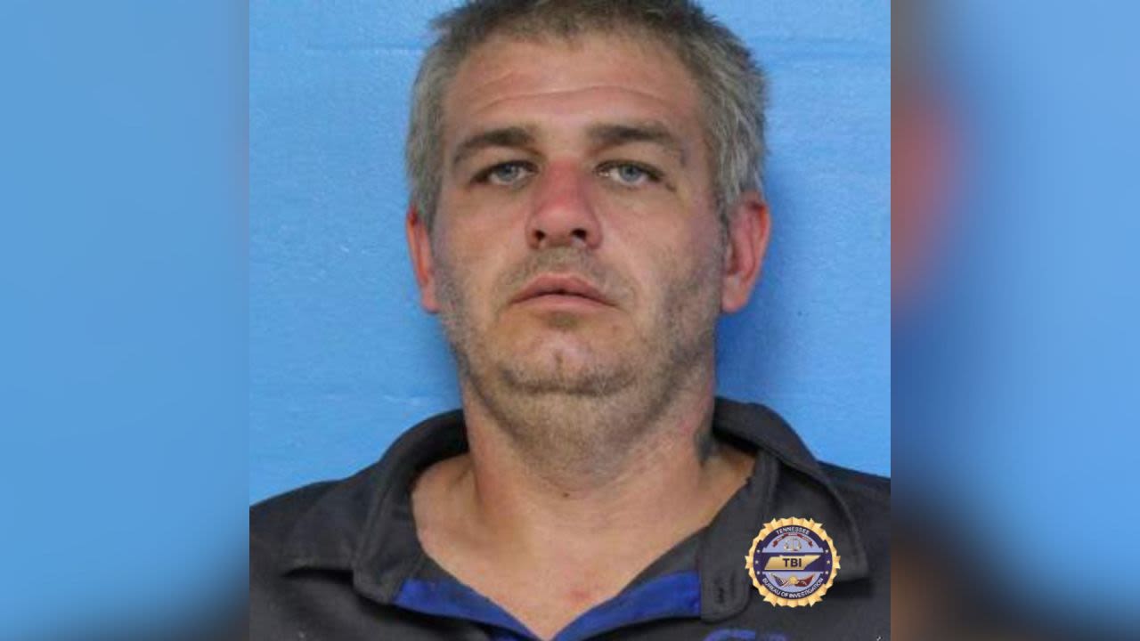 Second suspect arrested after man found dead in buried freezer in Carter County