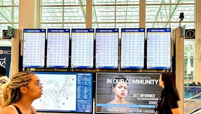 Debby hits NC, grounding more Charlotte airport flights and extending passenger misery