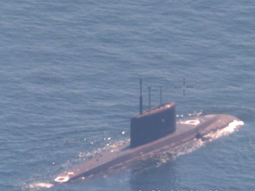 A NATO sub hunter captured these shots of a Russian submarine in waters newly surrounded by the alliance