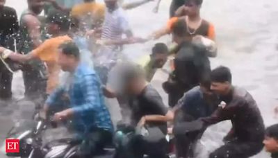 Lucknow waterlogging: Woman on two-wheeler groped, splashed with flooded water near Taj Hotel. Video goes viral - The Economic Times