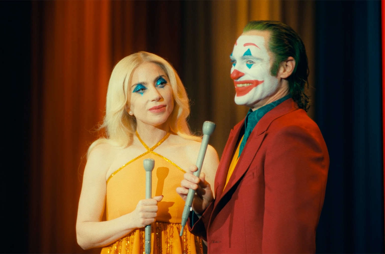 Lady Gaga & Joaquin Phoenix ‘Give the People What They Want’ in Darkly Chaotic ‘Joker’ Trailer: Watch