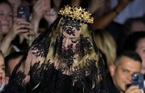 Madonna makes veiled entrance to Dolce&Gabbana for show celebrating her 1990s heyday