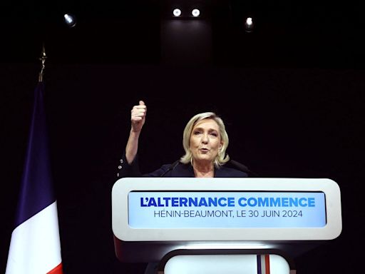 Marine Le Pen’s far-right National Rally party take the lead in first round of French election voting