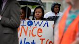 Justice Department warns it plans to sue Iowa over new state immigration law