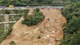 Death toll jumps to at least 48 as a search continues in southern China highway collapse