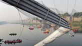 Dozens killed after bridge carrying hundreds collapses into river in India